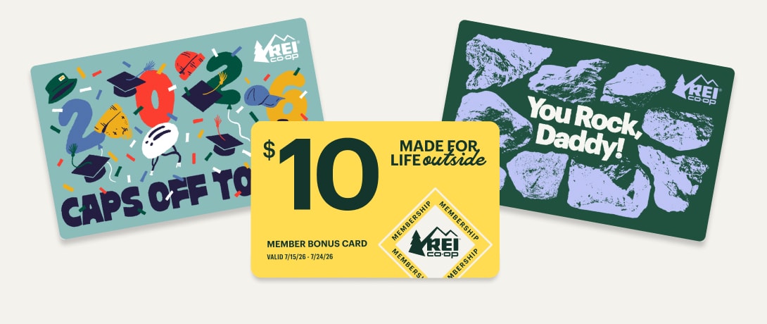 A graduation themed gift card, a Father’s Day themed gift card, and a yellow Member Bonus Card for $10 on a light colored background.