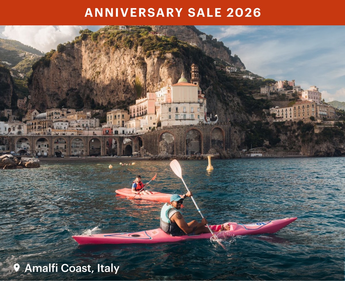 Text reads: ‘Anniversary Sale 2026’ over a photo of people kayaking in the Amalfi Coast.