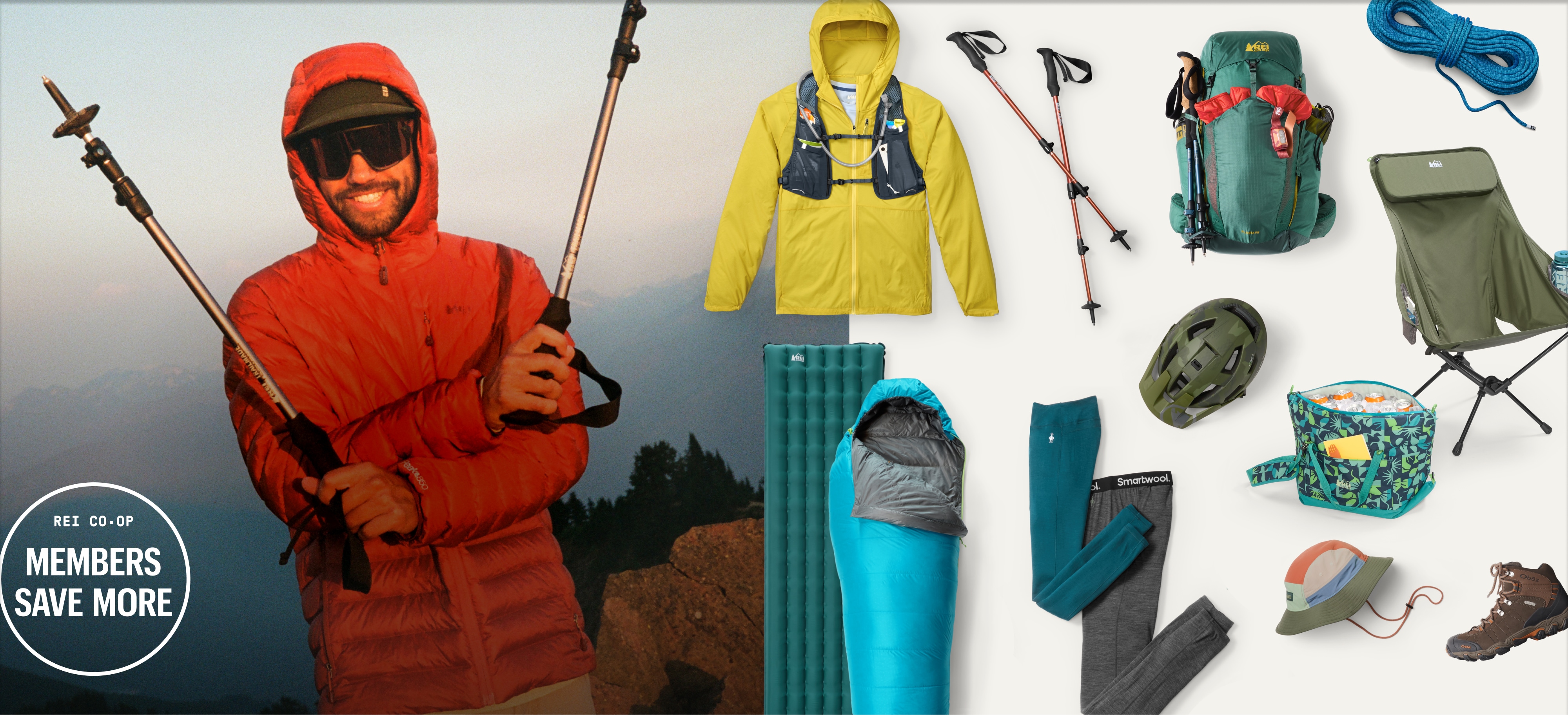 A person wearing a red jacket poses for the camera with their trekking poles.