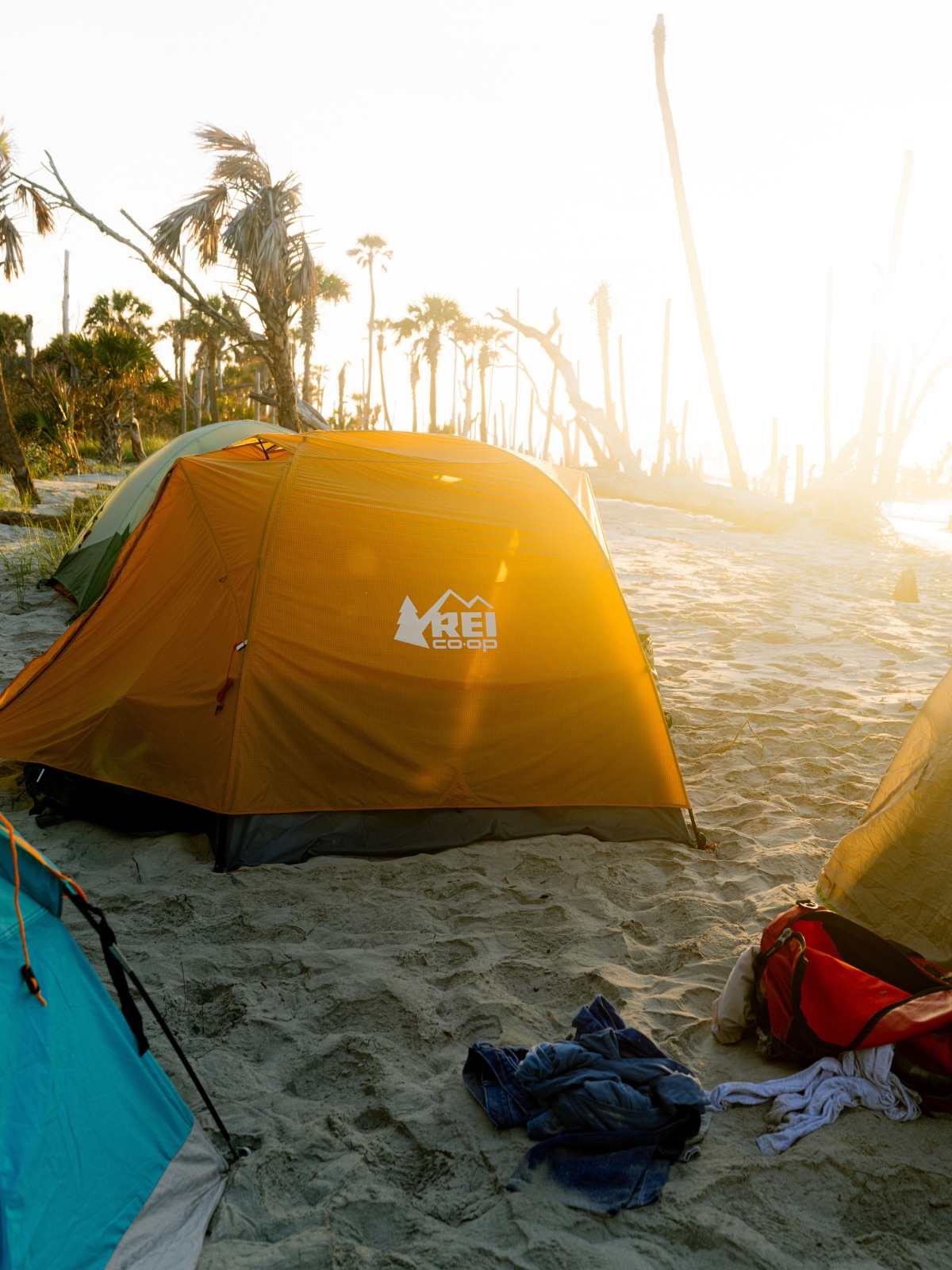 A group of tents set up on the sand.