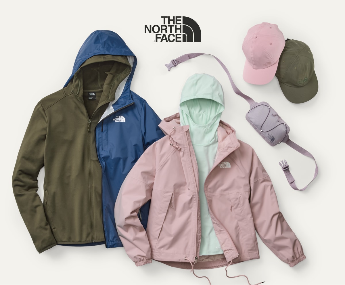 Clothing and accessories from The North Face on a light colored background.
