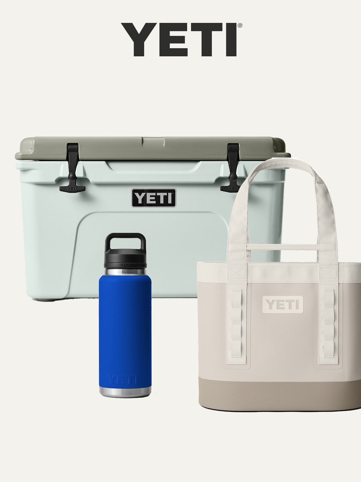 A cooler, bag, and insulated bottle from YETI on a light colored background.