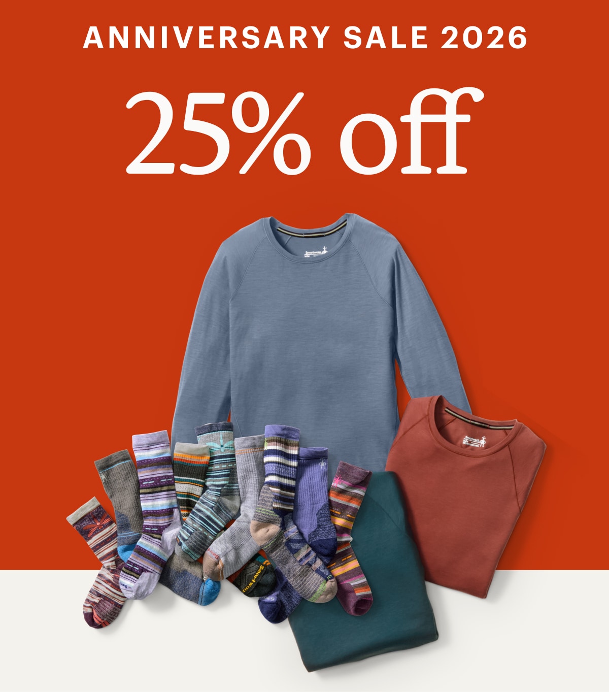 Text reads: ‘Anniversary Sale 2026. 25% off’ over a collage of Smartwool long-sleeve shirts and colorful socks.