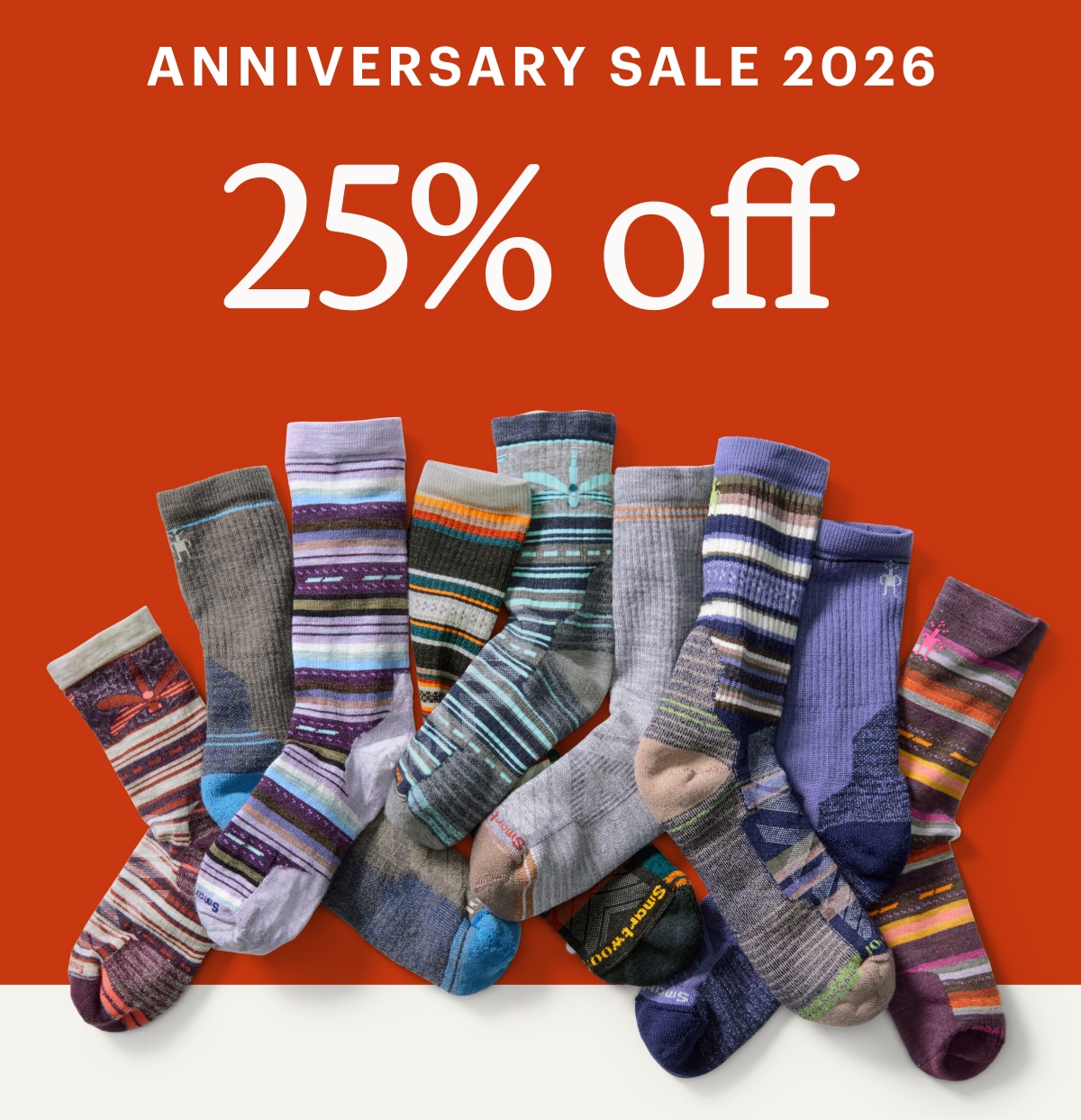 Text reads: ‘Anniversary Sale 2026. 25% off’ over a collage of colorful Smartwool socks.