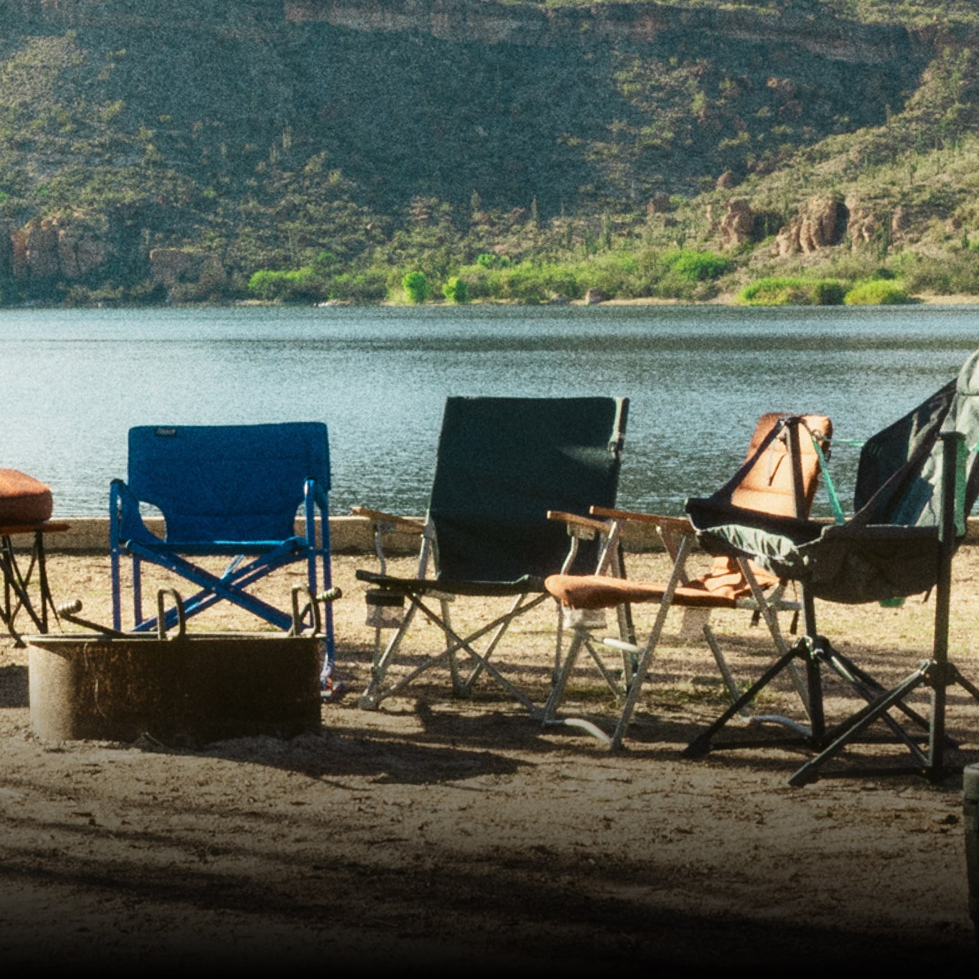 NEMO, R E I Co-op, & Coleman. Four camp chairs around a fire pit.