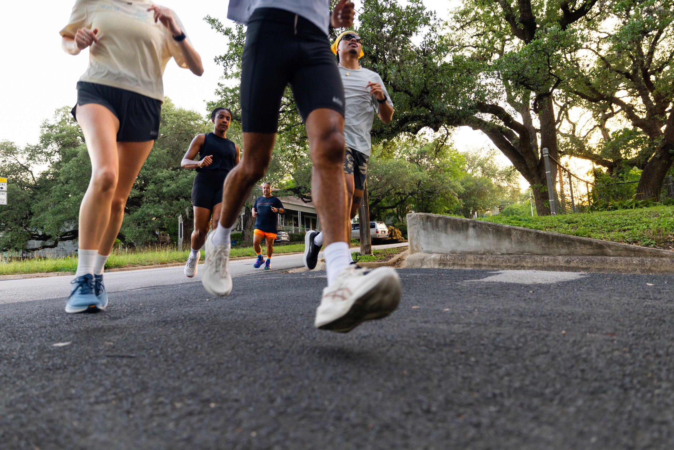 People running on a paved path