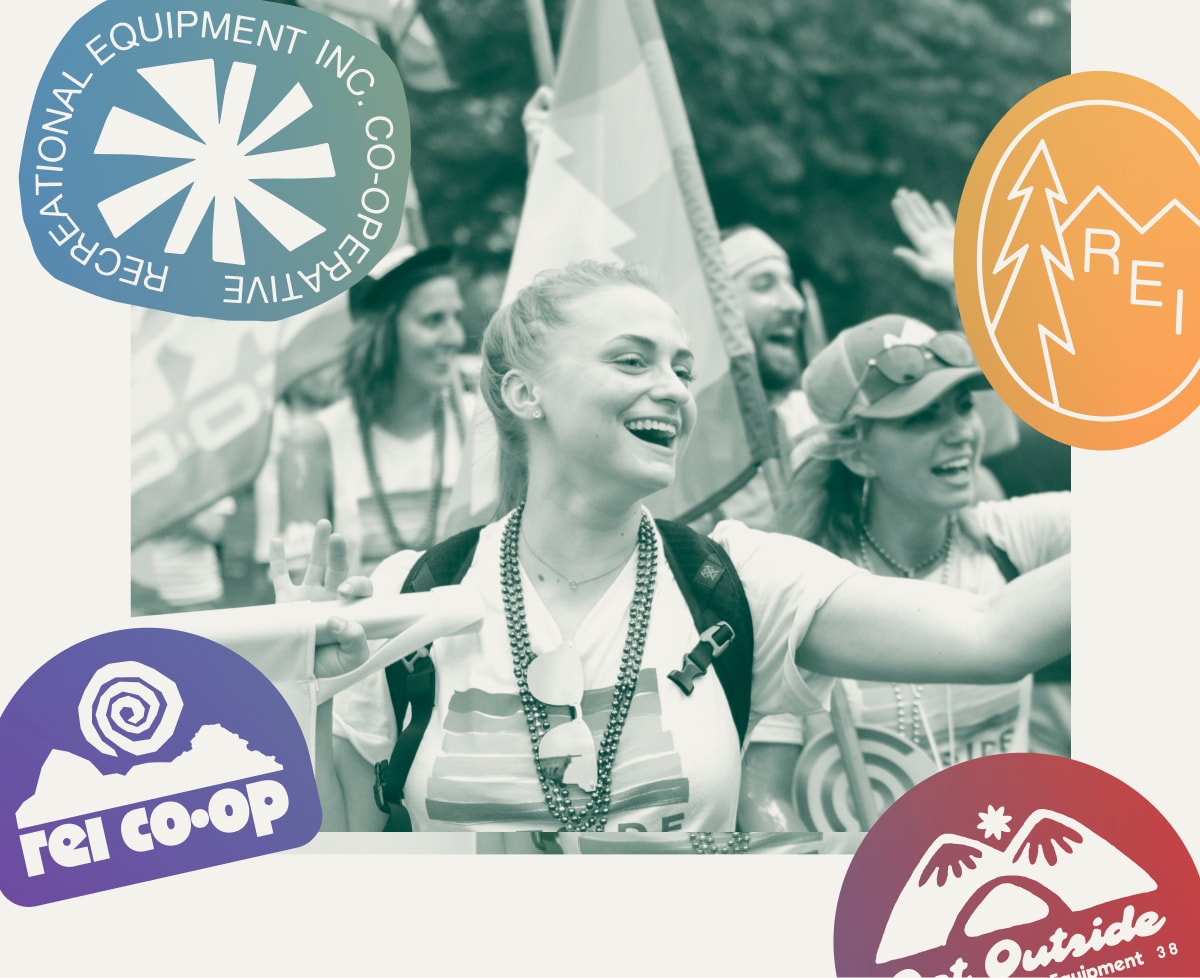 A photo of people at a Pride parade on a white background with colorful R E I Co-op stickers.