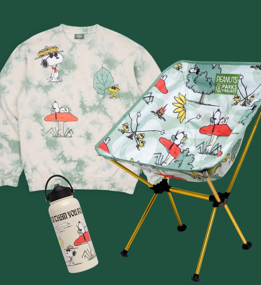 An insulated water bottle, crew sweatshirt, and camp chair from the Peanuts x Parks Project collaboration.