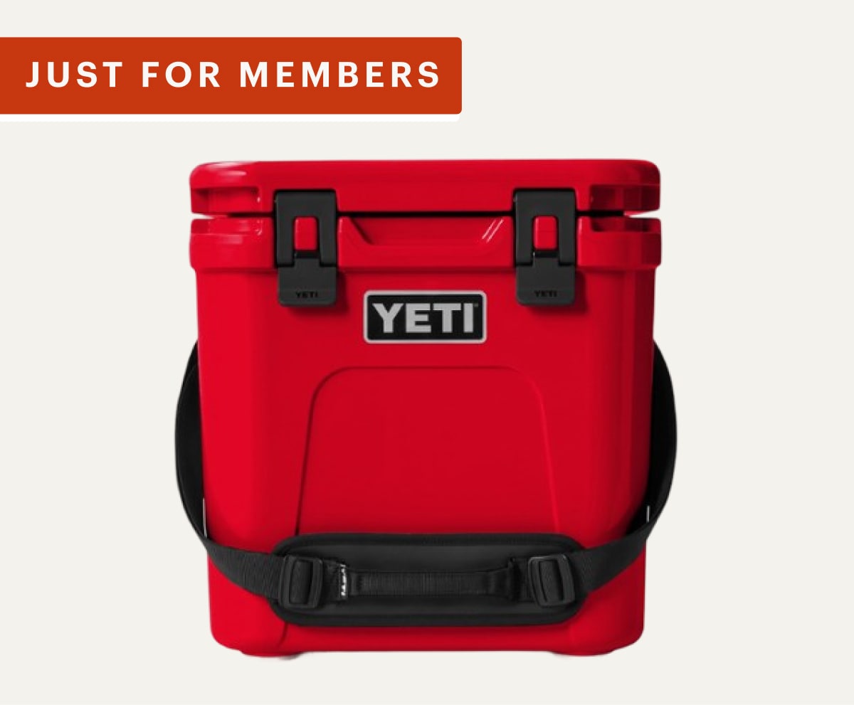 Just for members! A red YETI cooler on a light colored background.