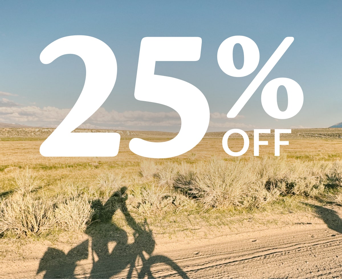 Text reads: ‘25% off’ on a photo of a shadow of someone riding their bike.