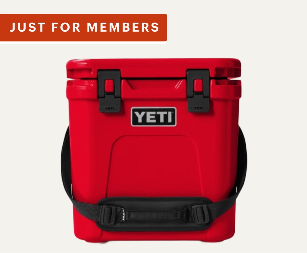 Just for members! A red YETI cooler on a light colored background.