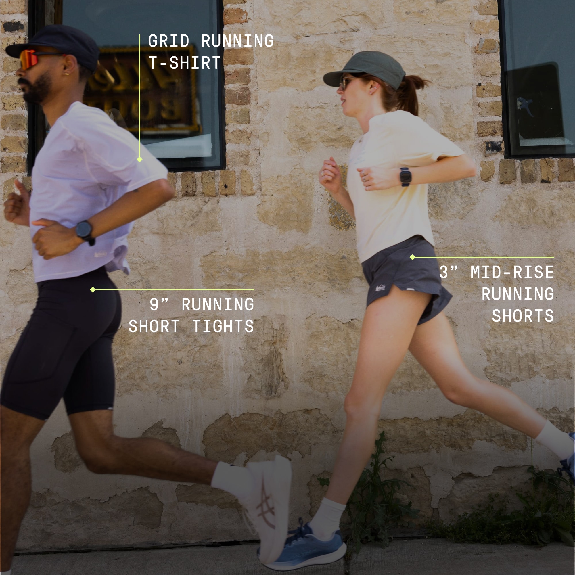 Two people running on a sidewalk.