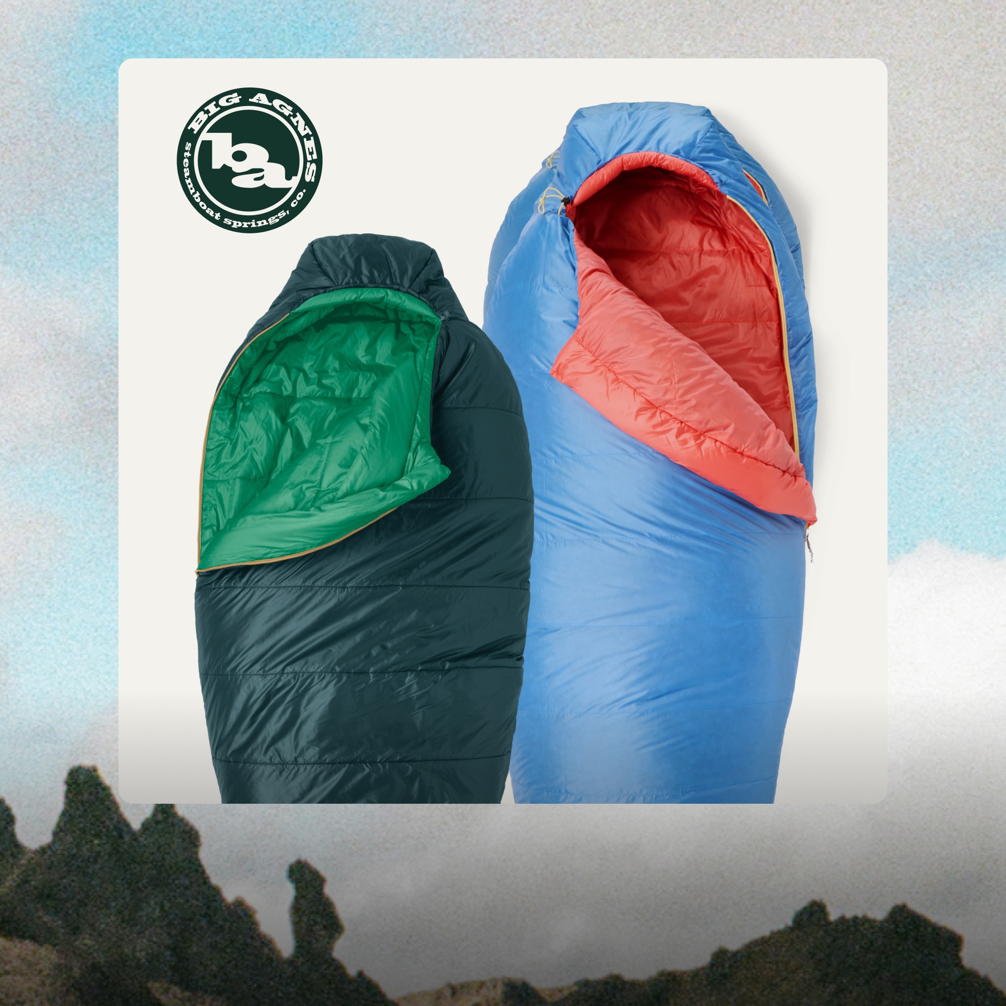 Two Big Agnes sleeping bags on a light colored background over an image of a grass covered mountain.