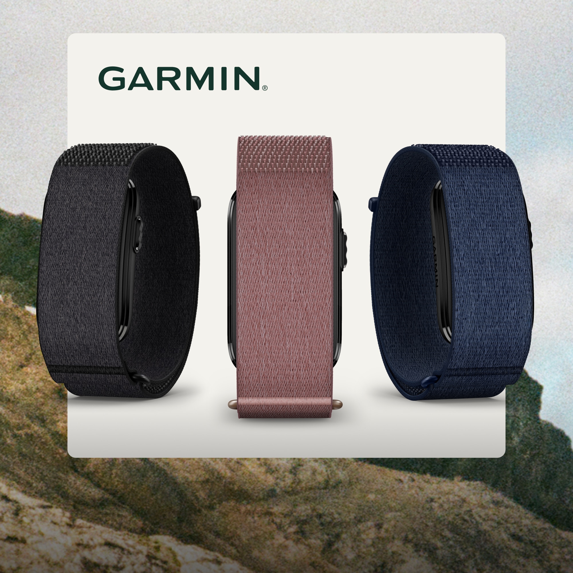 Three Garmin smart bands on a white background over an image of large mountains.