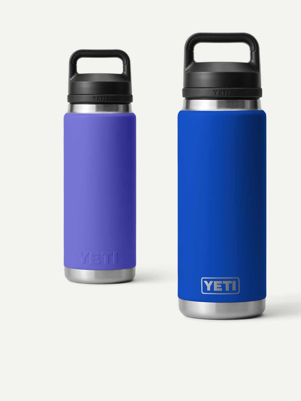Two YETI water bottles on a light colored background.