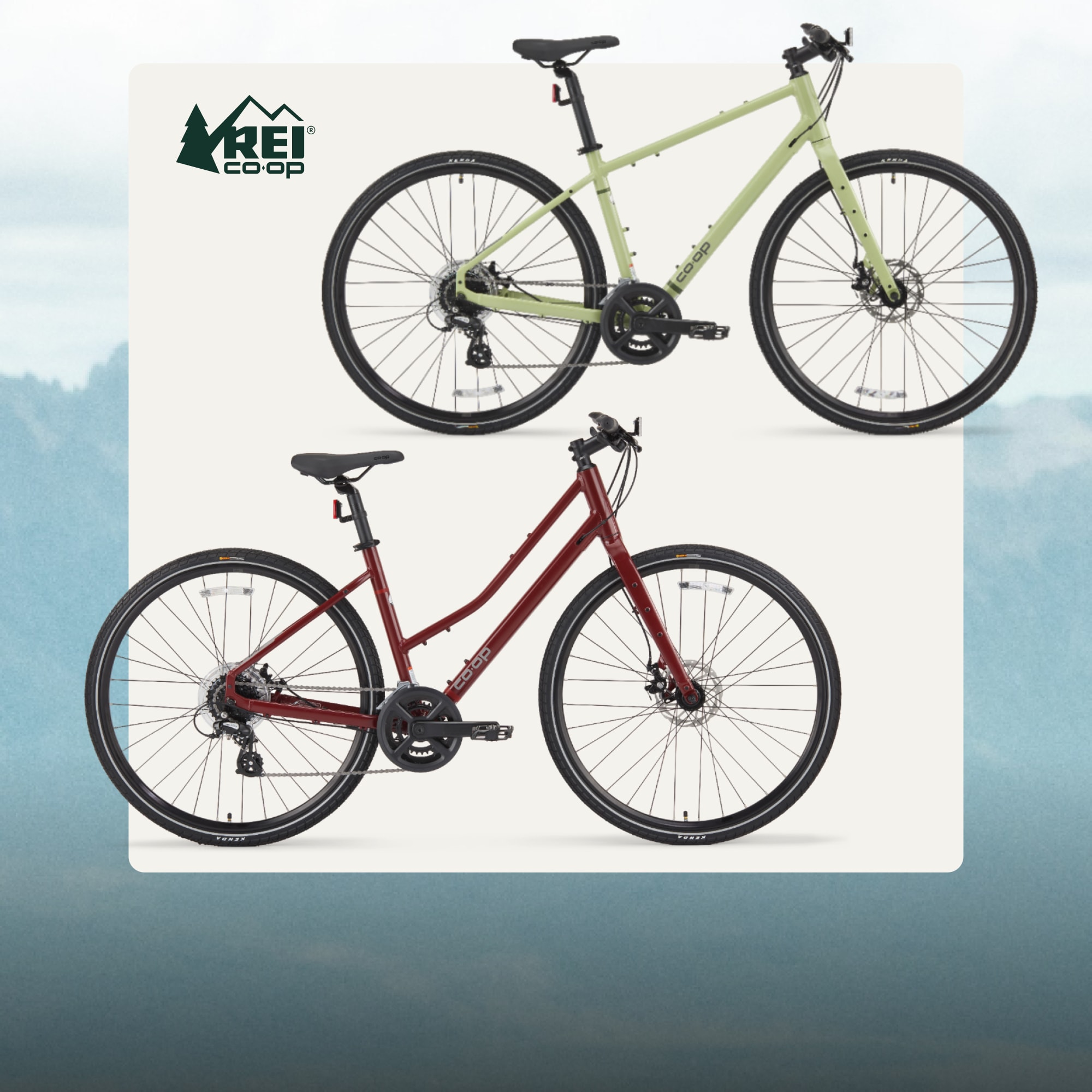 Two Co-op Cycles CTY 1.1 bikes on a light colored background over an image of grassy mountains.