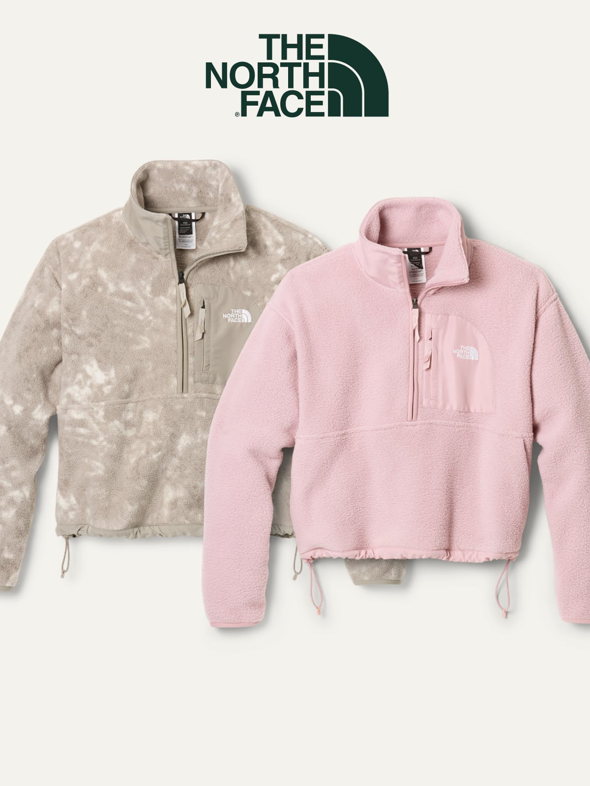 Two fleece jackets from The North Face on a light colored background.