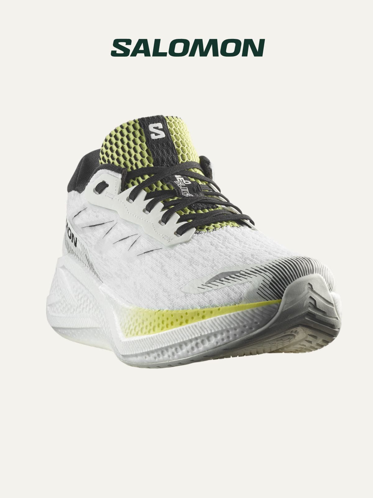 A Salomon running shoe on a light colored background.