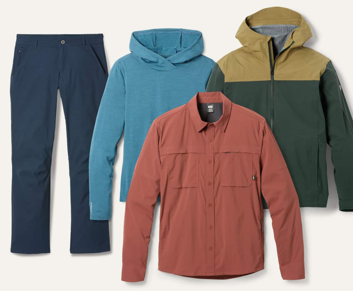 A collage of long-sleeve shirts, a jacket, & a pair of pants on a light colored background.