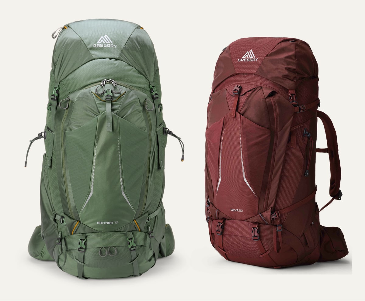 Two Gregory packs on a light colored background.