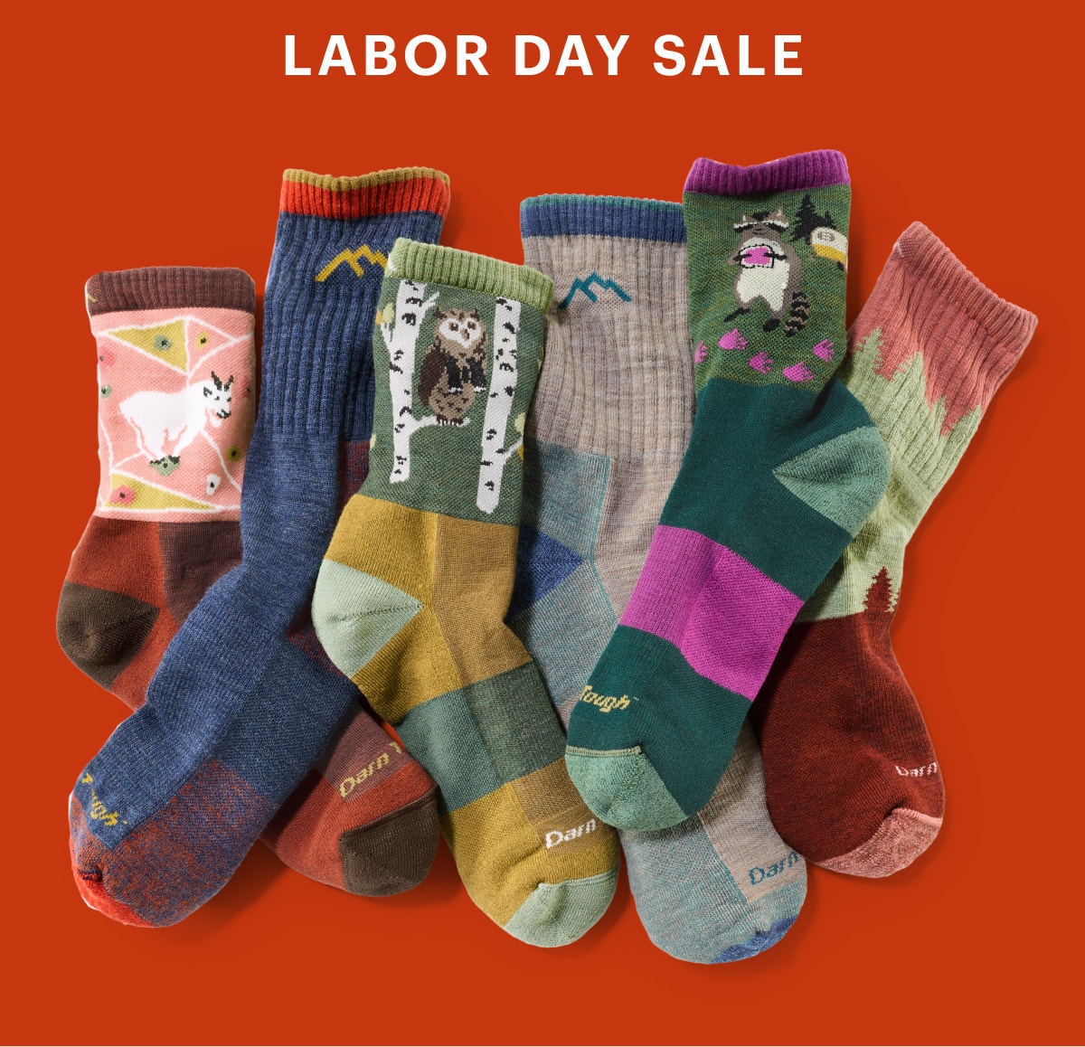 Text reads: ‘Labor Day Sale’ over a collage of colorful Darn Tough socks on a red background.