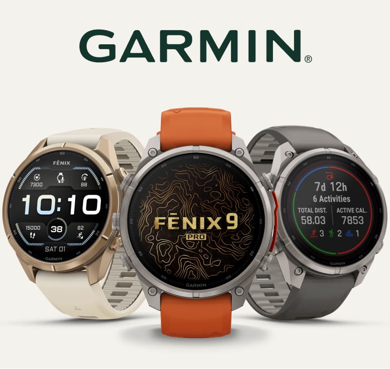 Three Garmin smartwatches on a light colored background.