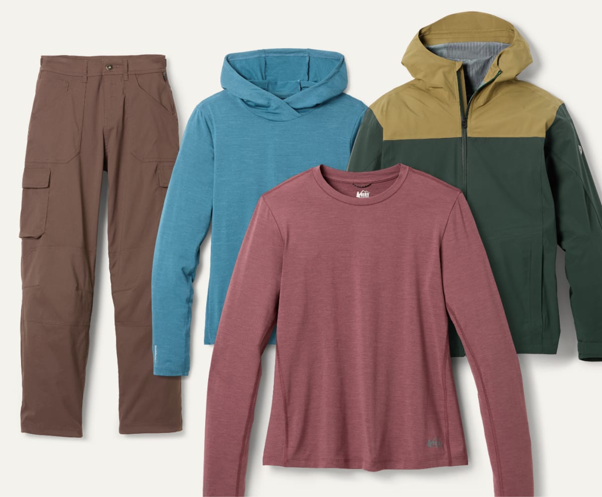 A collage of long-sleeve shirts, a jacket, & a pair of pants on a light colored background.