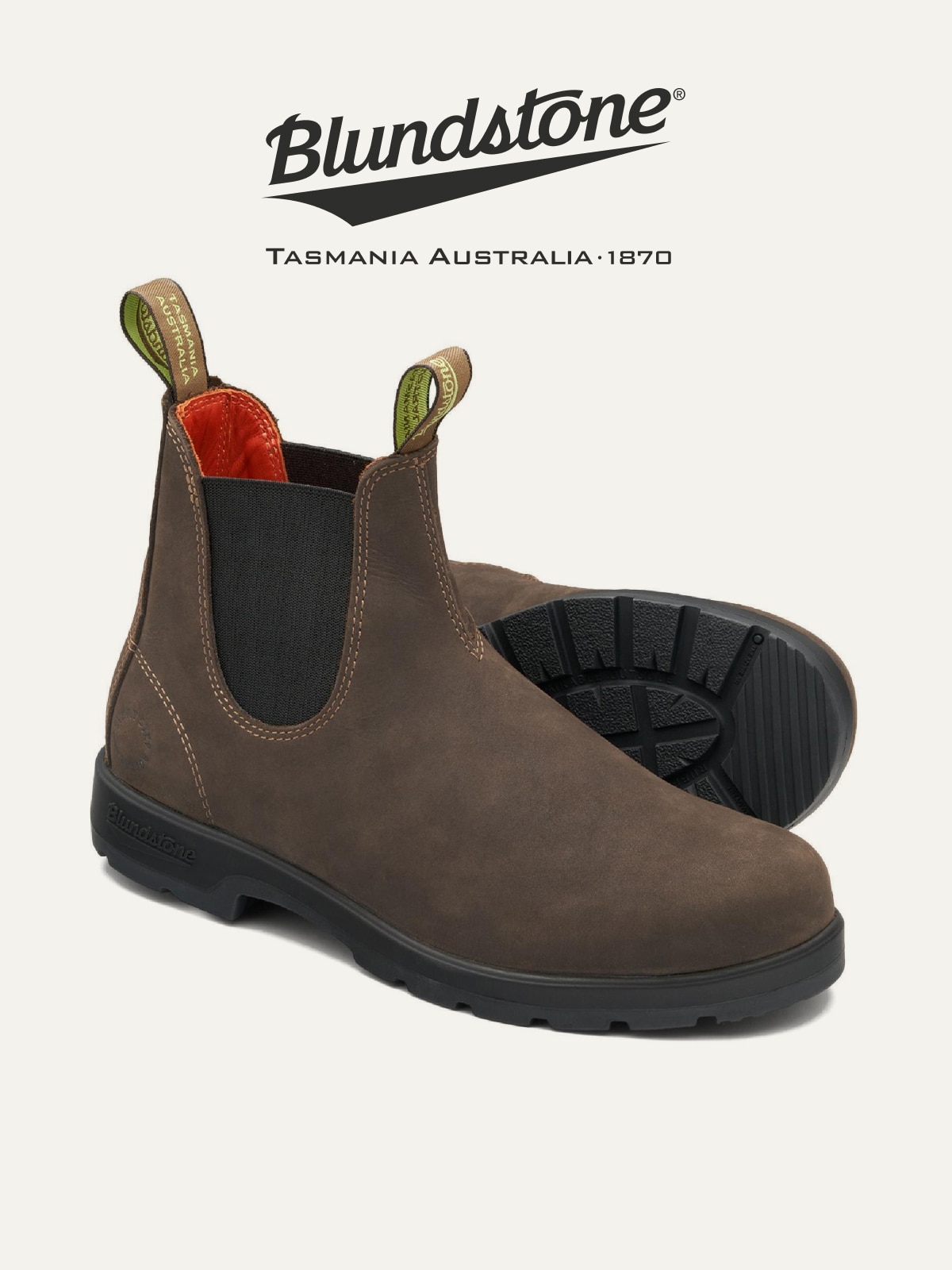 A pair of Blundstone boots on a light colored background.