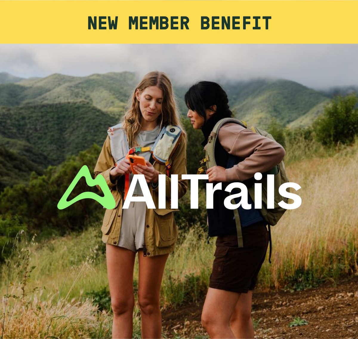 Text reads: 'AllTrails' over an image of two hikers looking at a cellphone.
