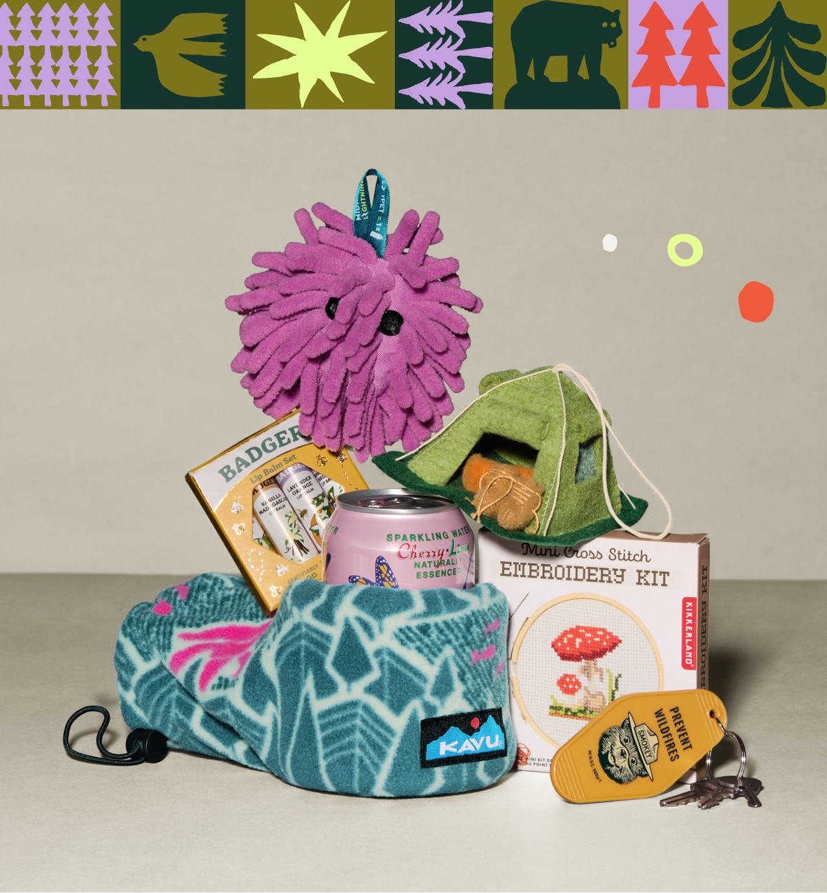 A collage of small gifts and stocking stuffers on a light colored background.