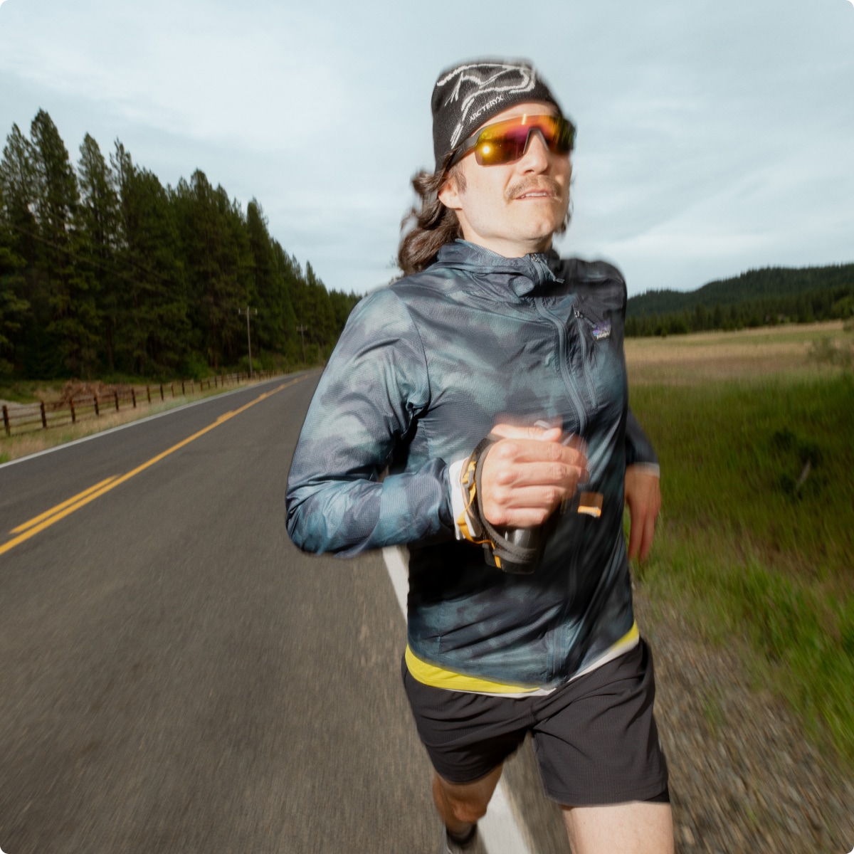 A person running along a paved road.