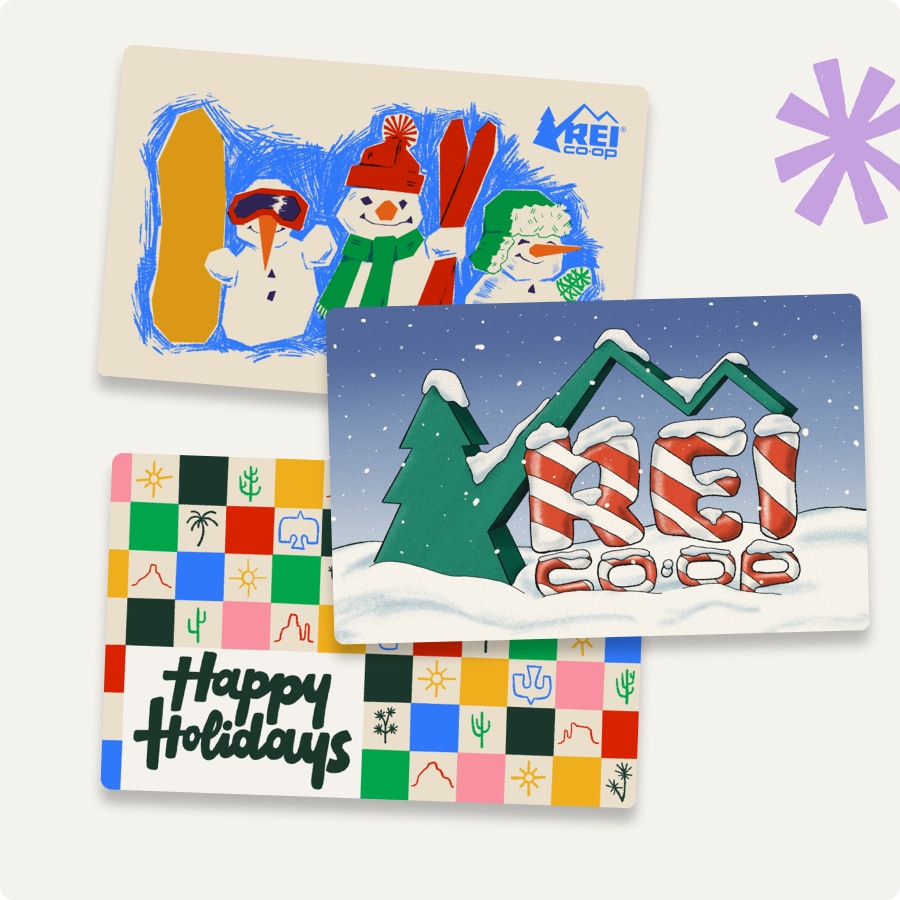 Three holiday-themed gift cards on a light colored background.