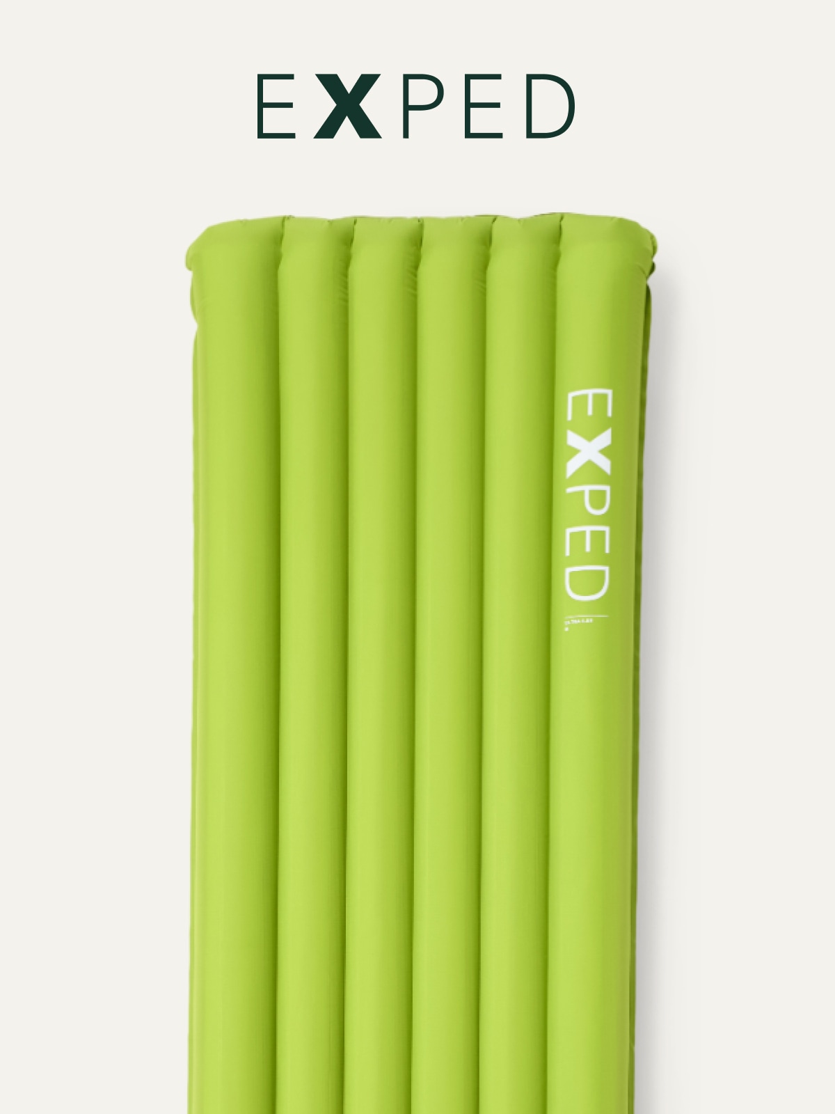 An Exped sleeping pad on a light colored background.