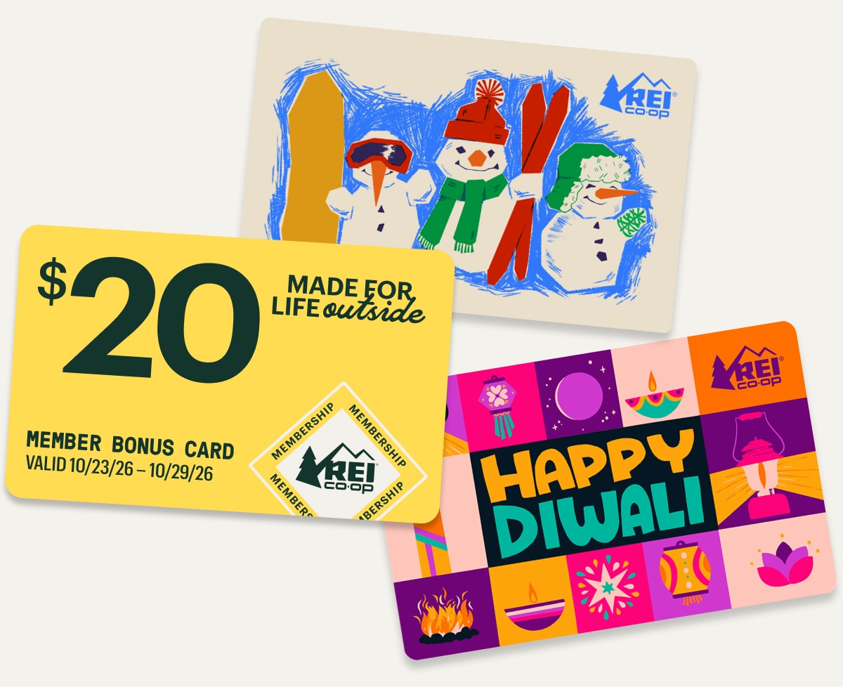 A yellow Member Bonus Card and two holiday-themed gift cards on a light colored background.