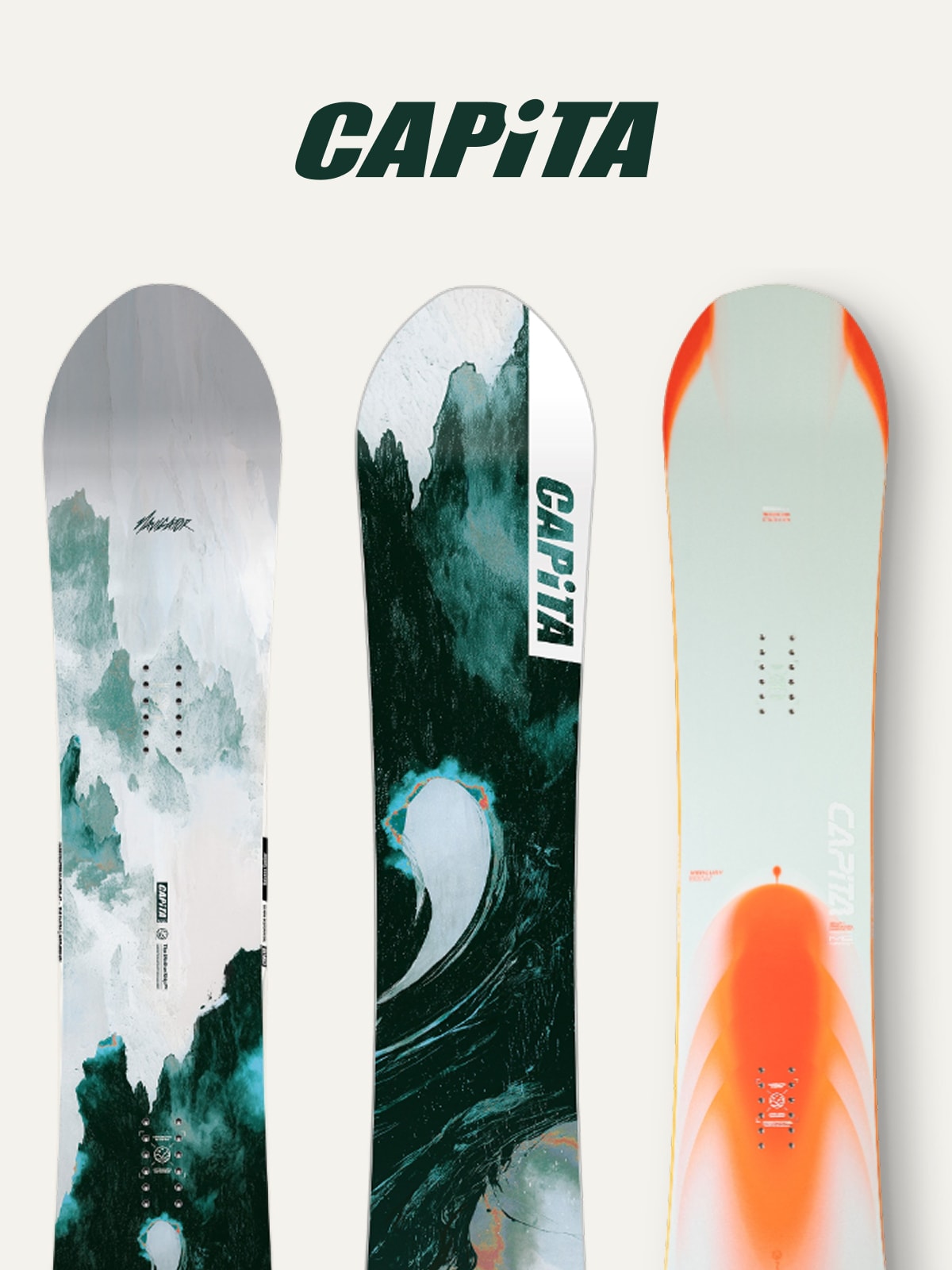 Three Capita snowboards on a light colored background.