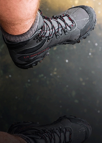 A hiker wears the La Sportiva Nucleo High II GTX Hiking boot