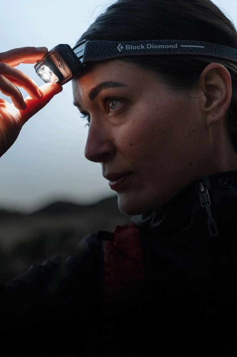 A hiker wears the Spot 400 headlamp