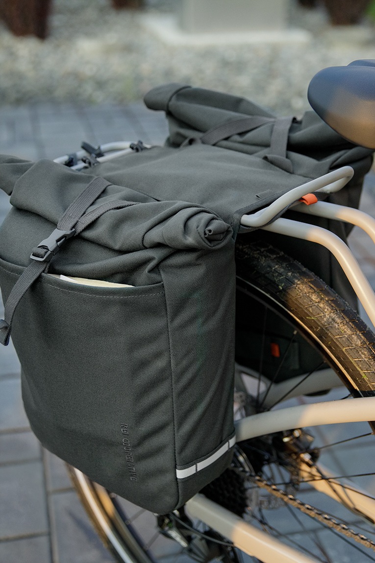 A pannier is attached to a rear bike rack for carrying gear.