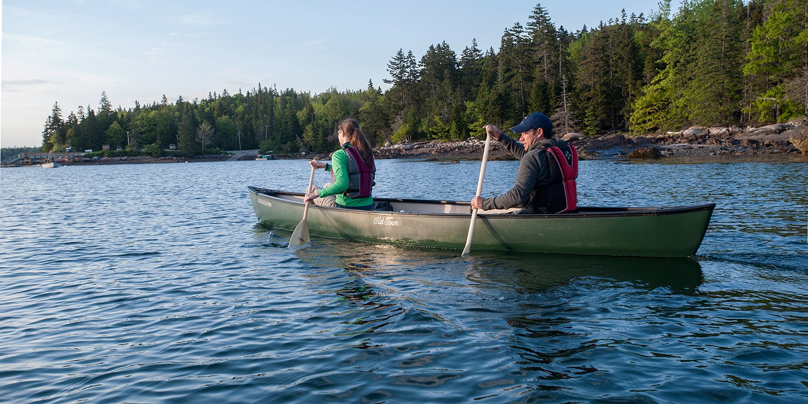 Two people paddling a canoe