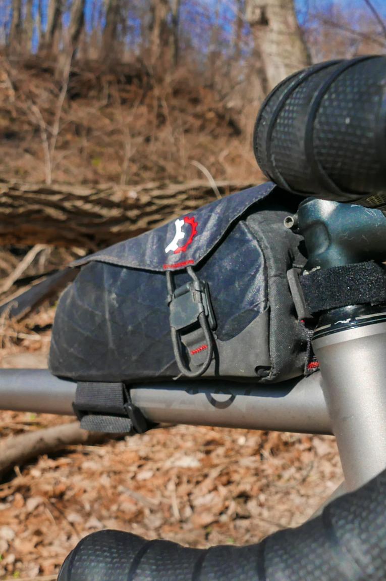 A bike bag sits on the top tube of the bike for easy access to gear.