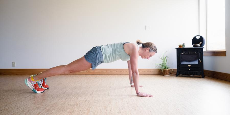 A woman performs a plank