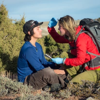 a hiker performs first aid