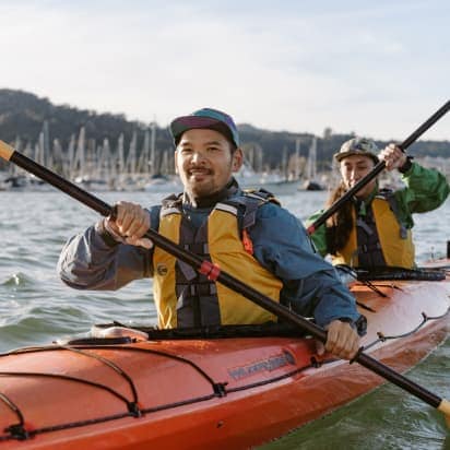 two kayakers paddling