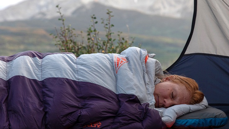 A woman sleeping in the Kelty Cosmic 20 in Colorado.