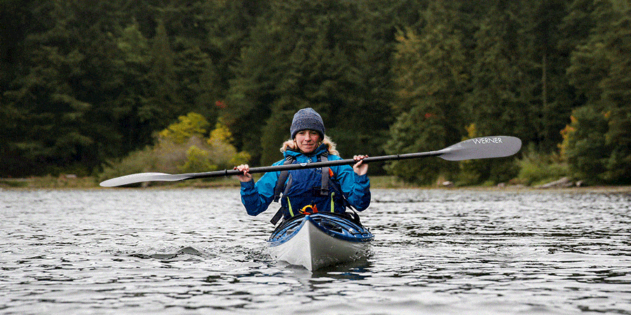 Instructor demonstrates an edging exercise in the kayak