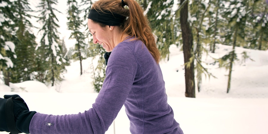 a cross-country skier wearing a headband and gloves