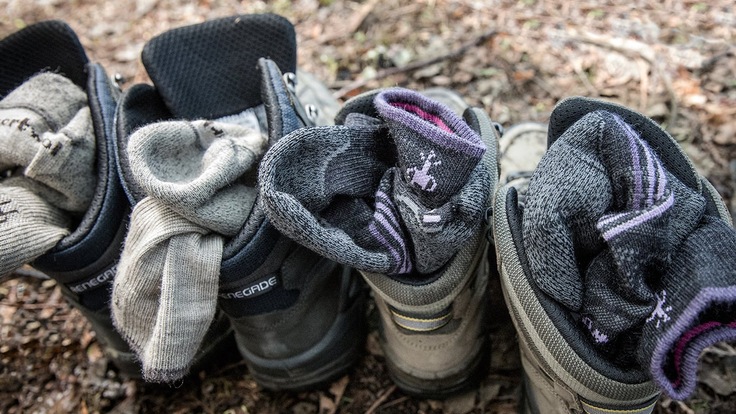 4 hiking boots with socks in them