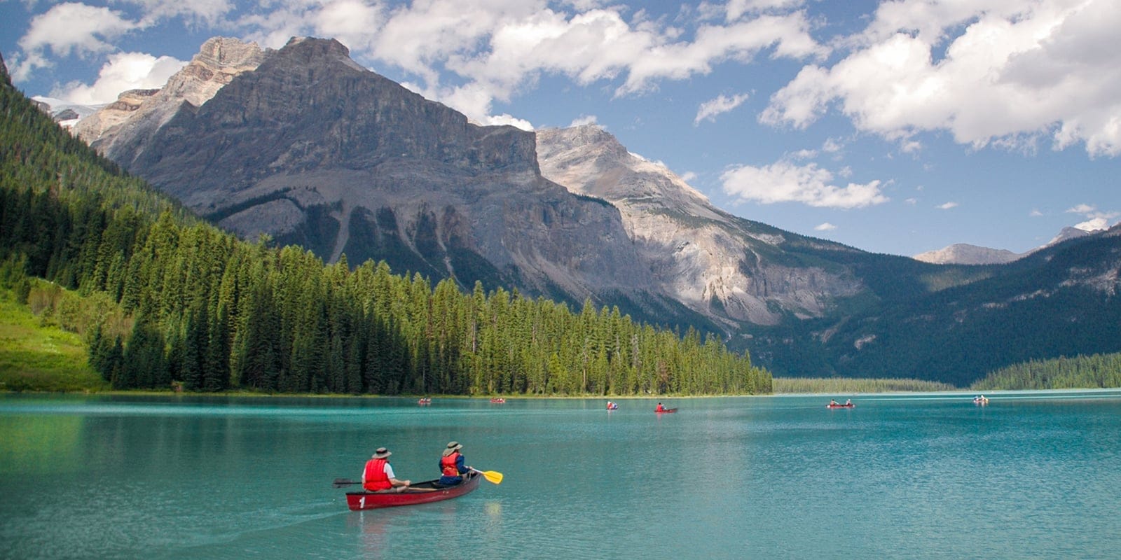 a red canoe on a lake