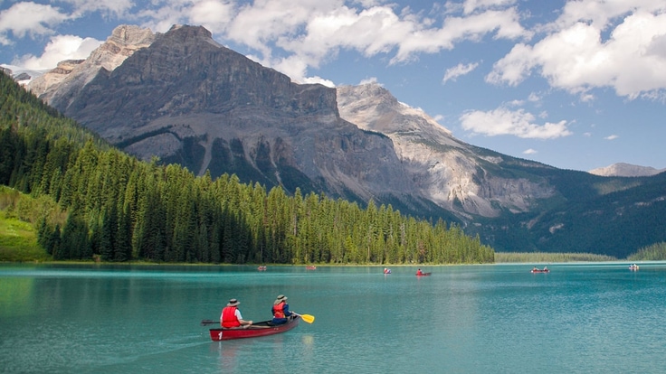 a red canoe on a lake