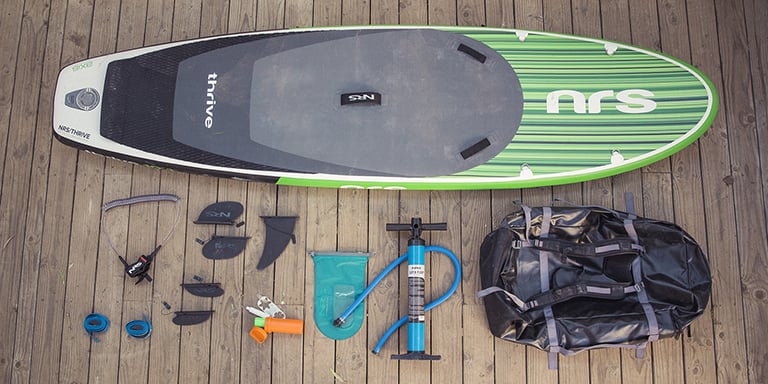 paddle boarding gear on the ground